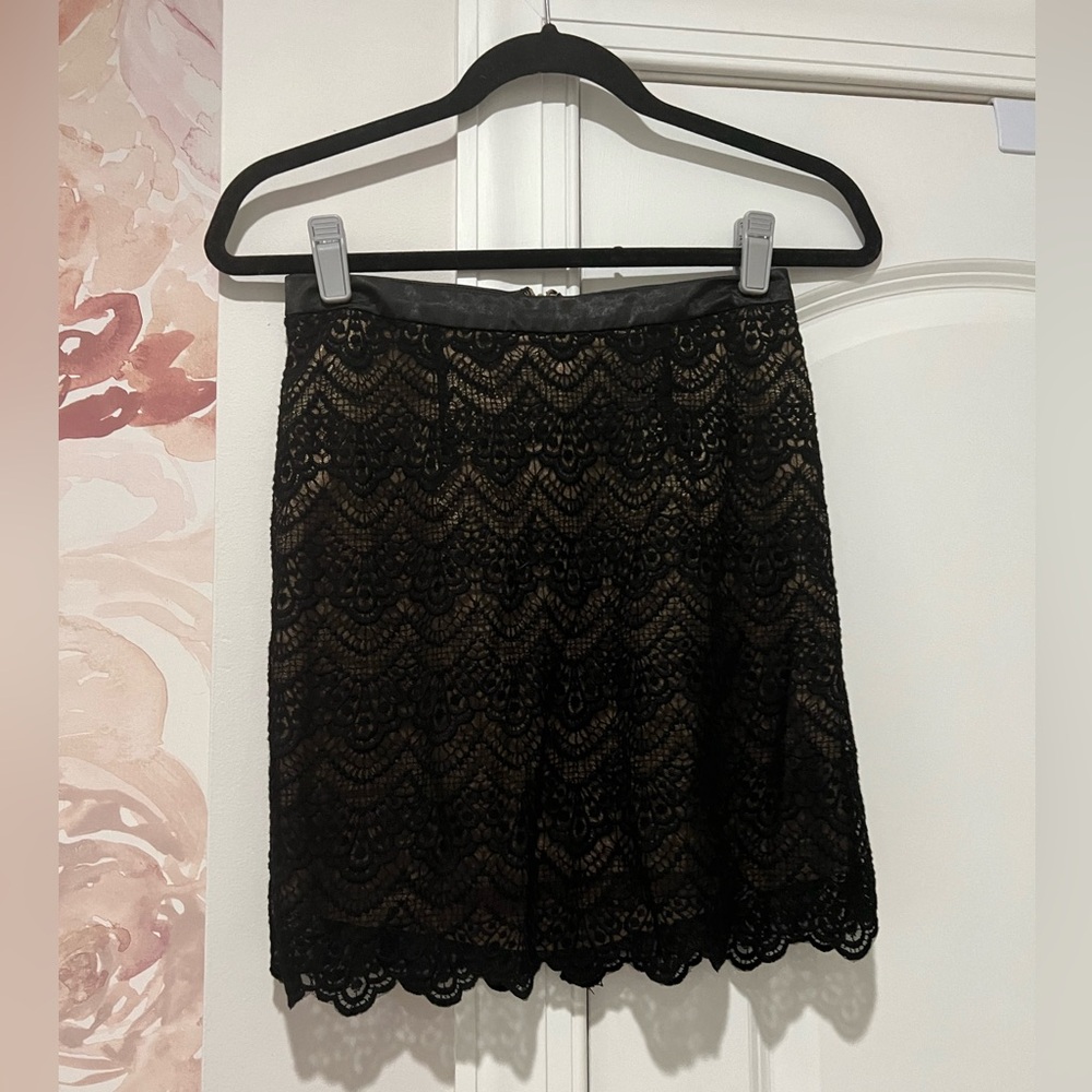 Guess lace black mini skirt size 2, tan underlay.